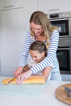 Happy family preparing lunch together at home in the kitchen