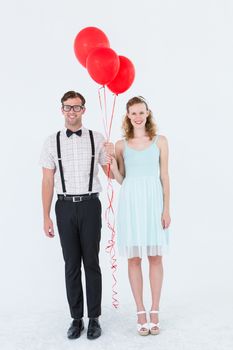 Geeky hipster couple hands in hands looking at camera on white background