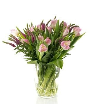 boueqt of pink tulips on vase from glass as present or git to girlfriend mother or other love one