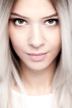 portrait of attractive Caucasian girl with shiny blond hair. shallow depth of field