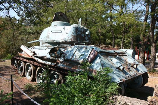 Old military tank as a relic of World War II in the forest near Vrsac in Serbia