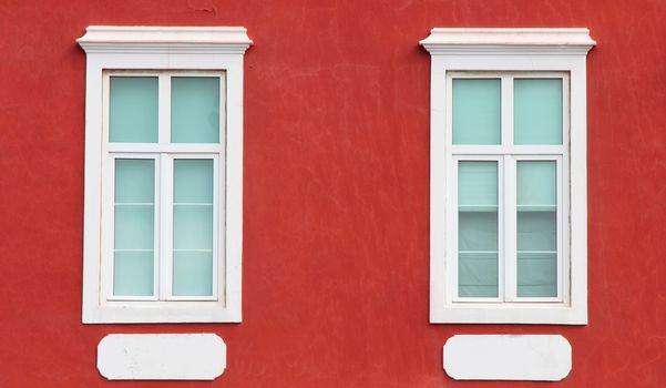 Spain. Canary Islands. Gran Canaria island. Las Palmas de Gran Canaria. Detail of ochre facade with two windows