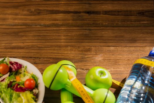 Indicators of healthy lifestyle on wooden table