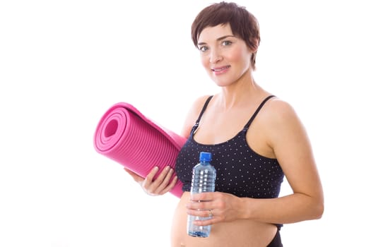 Pregnant woman keeping in shape on white background