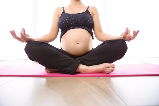 Pregnant woman keeping in shape at home