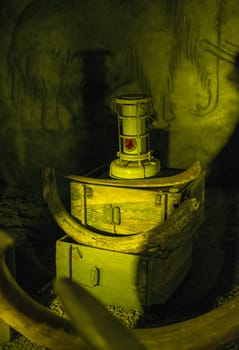 old suitcases and vintage oil lamp light in special light with dark background 