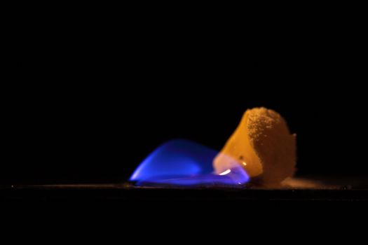 A macro photography of burning sulfur powder.