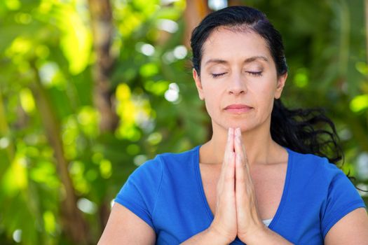 Relaxed woman doing yoga on a sunny day