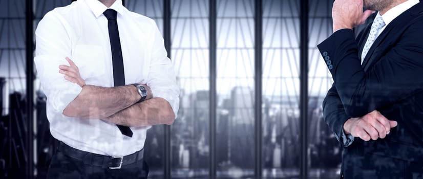 Smiling businessman with arms crossed against room with large window looking on city