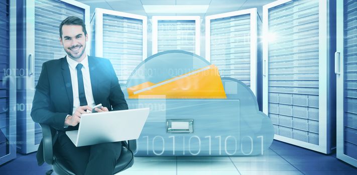 Happy businessman with laptop using smartphone against composite image of cloud computing drawer