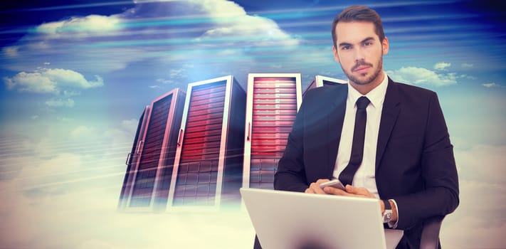 Cheerful businessman with laptop using smartphone against composite image of server towers