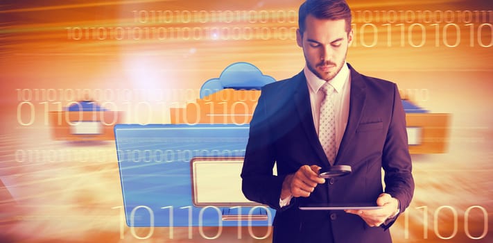 Concentrated businessman using magnifying glass against composite image of cloud computing drawer