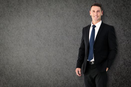 Happy businessman against grey background