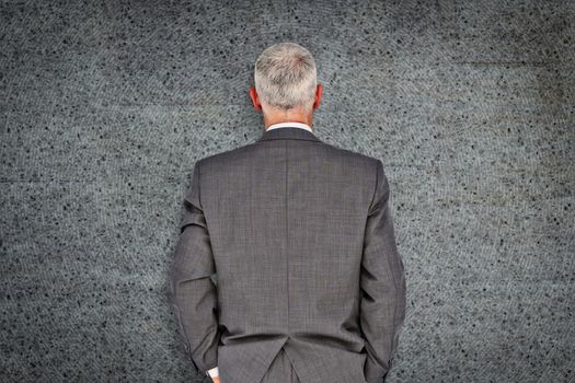 Businessman against grey background