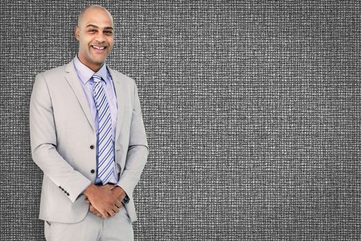 Happy businessman against grey background