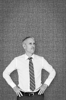 Thinking businessman against grey background