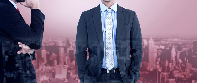 Businessman looking at the camera against high angle view of city