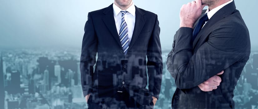 Frowning businessman thinking  against high angle view of city