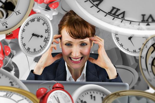 Stressed businesswoman against grey background