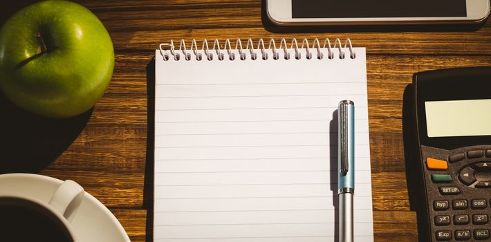 Overhead shot of notepad on a students desk