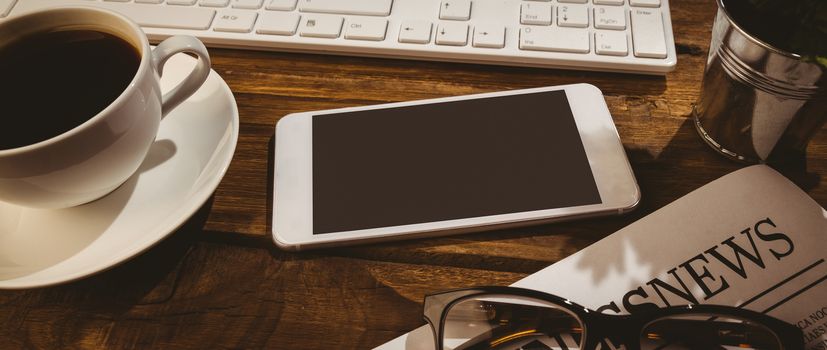 Overhead shot of smartphone on a business desk