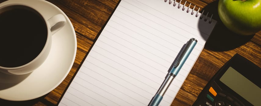 Overhead shot of notepad on a desk