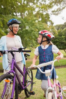 Grandmother and daughter on their bike on a sunny day