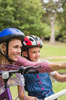 Mother and her daughter on their bike on a sunny day