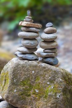 Two Stacks of Balancing Rocks by River Bed in Columbia River Gorge