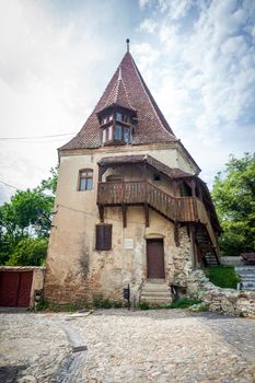 Sighisoara, Romania - June 23, 2013: Shoemakers tower (Turnul Cizmarilor) part of  Sighisoara fortress in Transylvania, Romania