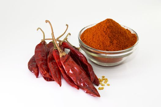 chilly powder in bowl with red chilly, dried chillies