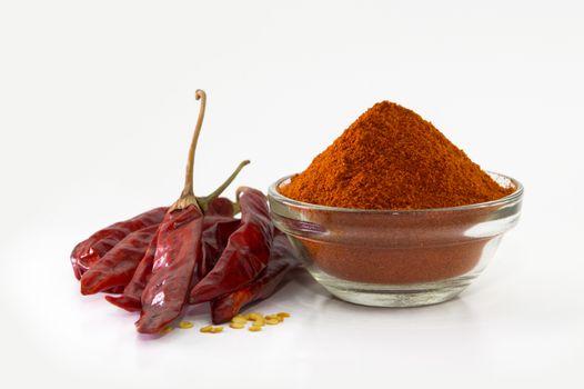 chilly powder in bowl with red chilly, dried chillies