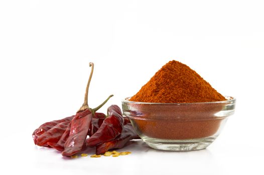 chilly powder in bowl with red chilly, dried chillies