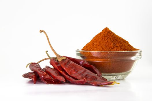 chilly powder in bowl with red chilly, dried chillies