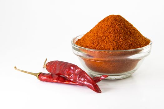 chilly powder in bowl with red chilly, dried chillies