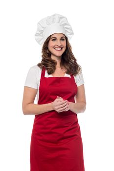 Female chef posing with hands clasped
