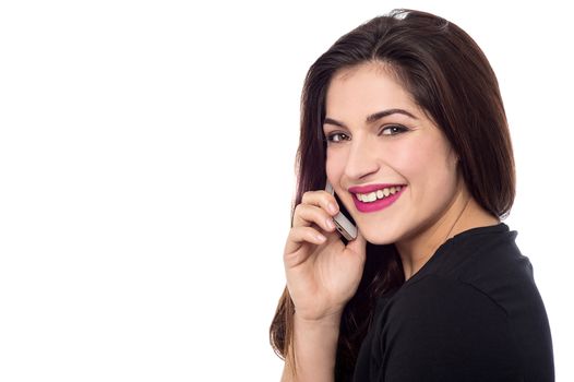 Side pose of woman talking on her cell phone