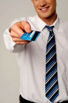 Cropped image of businessman giving his credit card