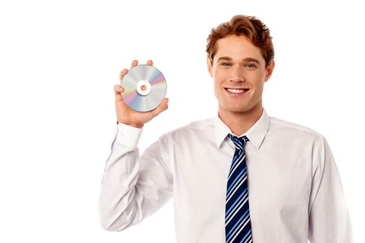 Young sales executive showing a new cd-rom