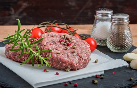 Raw Minced Hamburger Meat with Herb and Spice Prepared for Grilling