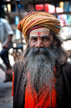 Portrait of undefined sadhu man with big beard and turban, Old Delhi, India. March 28, 2012