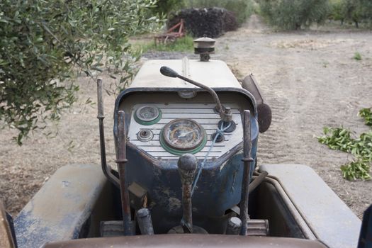 An old tractor still working and used to clean the fields