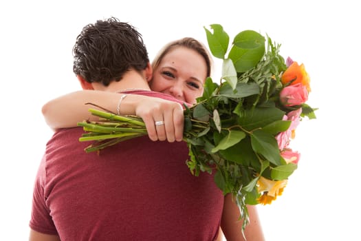 Girl is happy with bouquet of flowers giving by boyfriend over white background