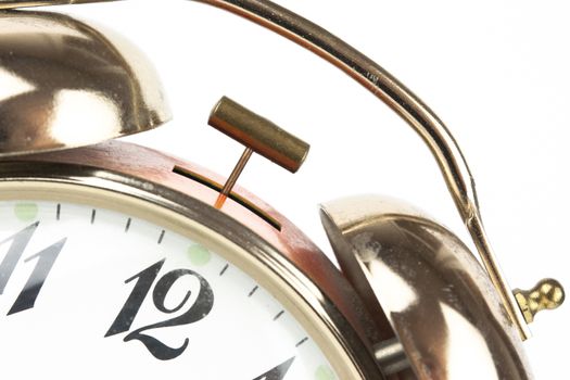 Close up of an alarm clock on a white background