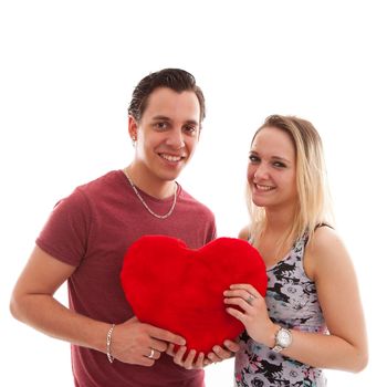 Young couple in love holding heart over white background