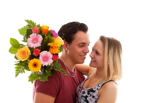 Girl is happy with bouquet of flowers giving by boyfriend over white background