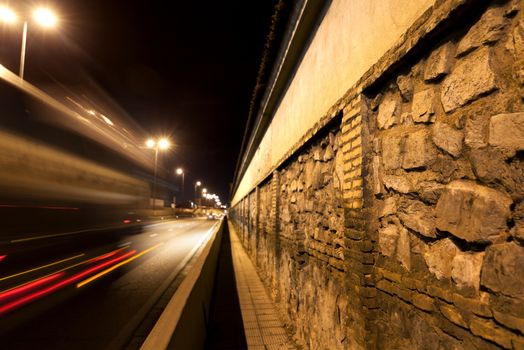 City street at night.Wall cobble and road