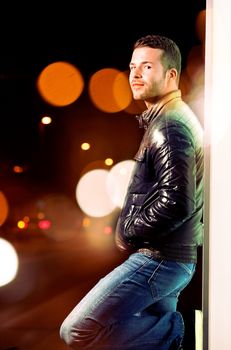 Young man portrait.City at night