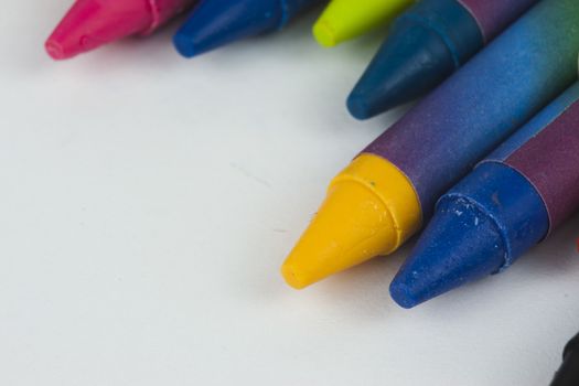 Close up of different coloured crayons