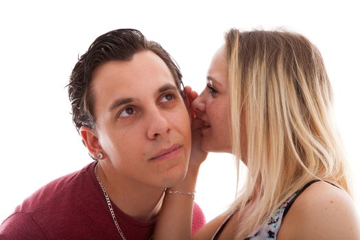 girl is whispering in ear of boyfriend isolated on white background